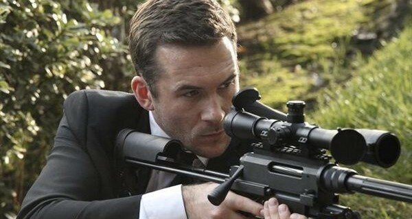 Aiden (Barry Sloane) takes aim in 'Collusion'