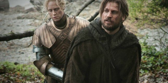 Brienne (Gwendoline Christie) escorts Jamie (Nikolaj X) for a 'Walk Of Punishment'