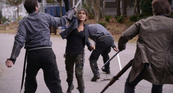 Nora (Daniella Alonso) and Miles (Billy Burke) fight off militia in the street in 'Ghosts'